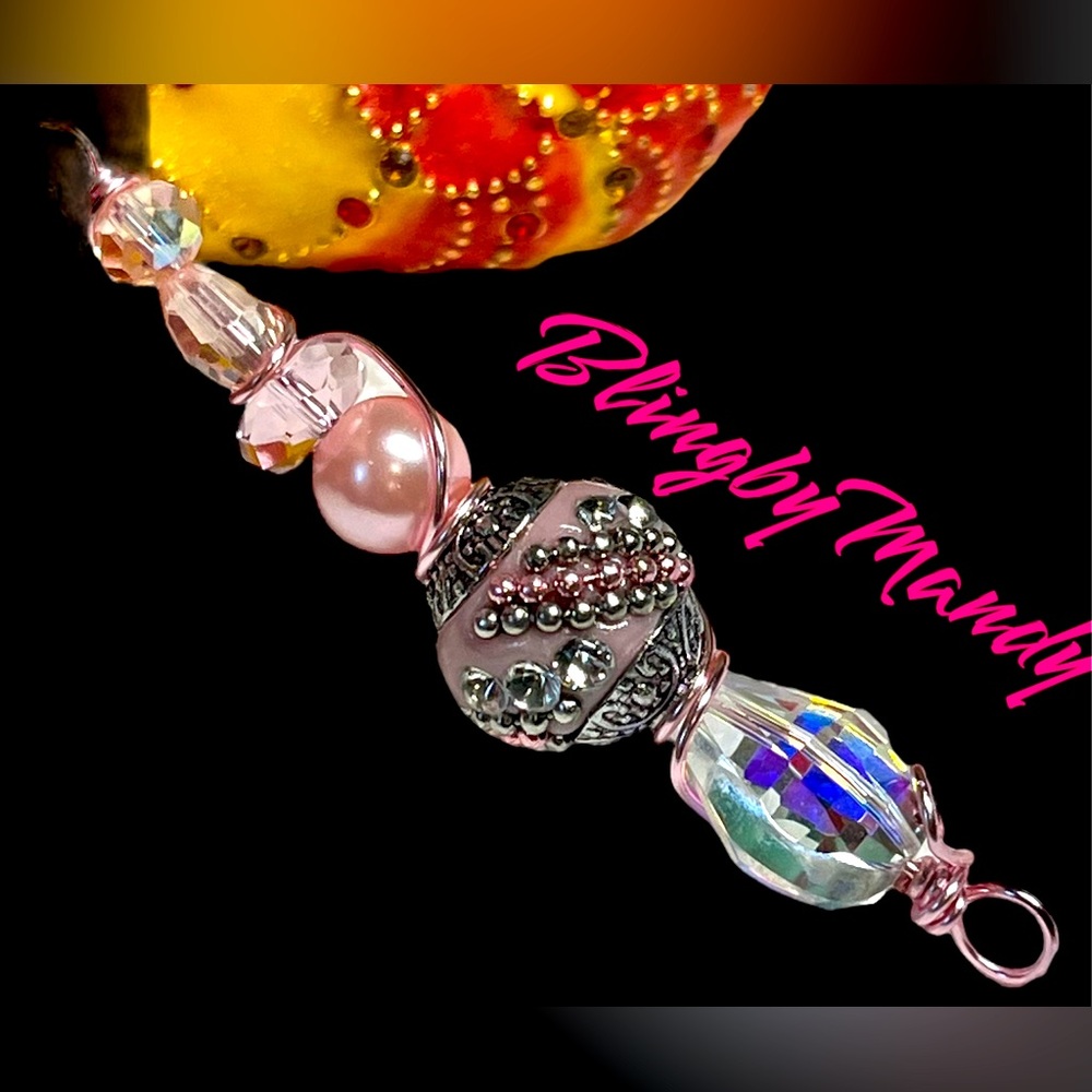 Pink and silver pretty Indonesian bead made into a unique wrapped pendant